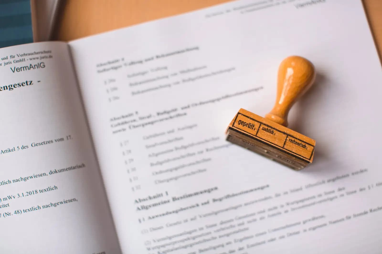 A wooden rubber stamp on an open legal document
