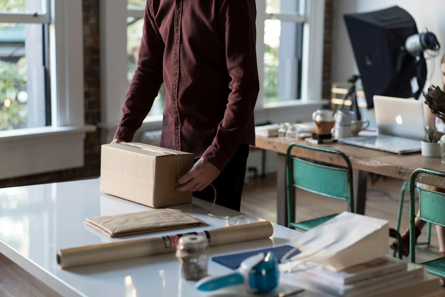 Packing a parcel at a work desk