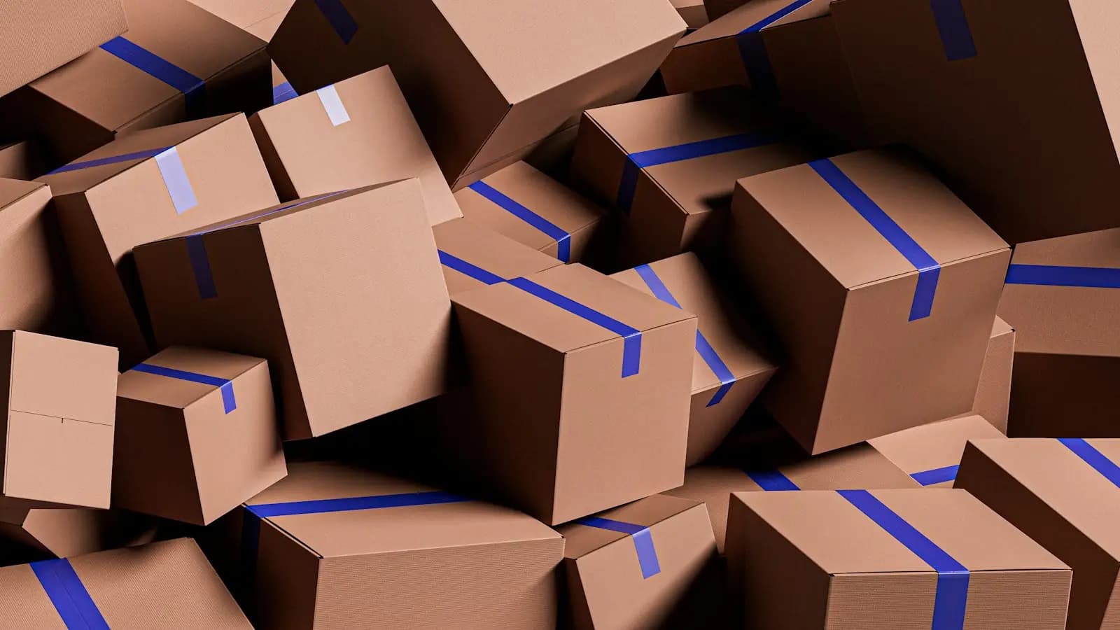 A pile of cardboard boxes with blue tape