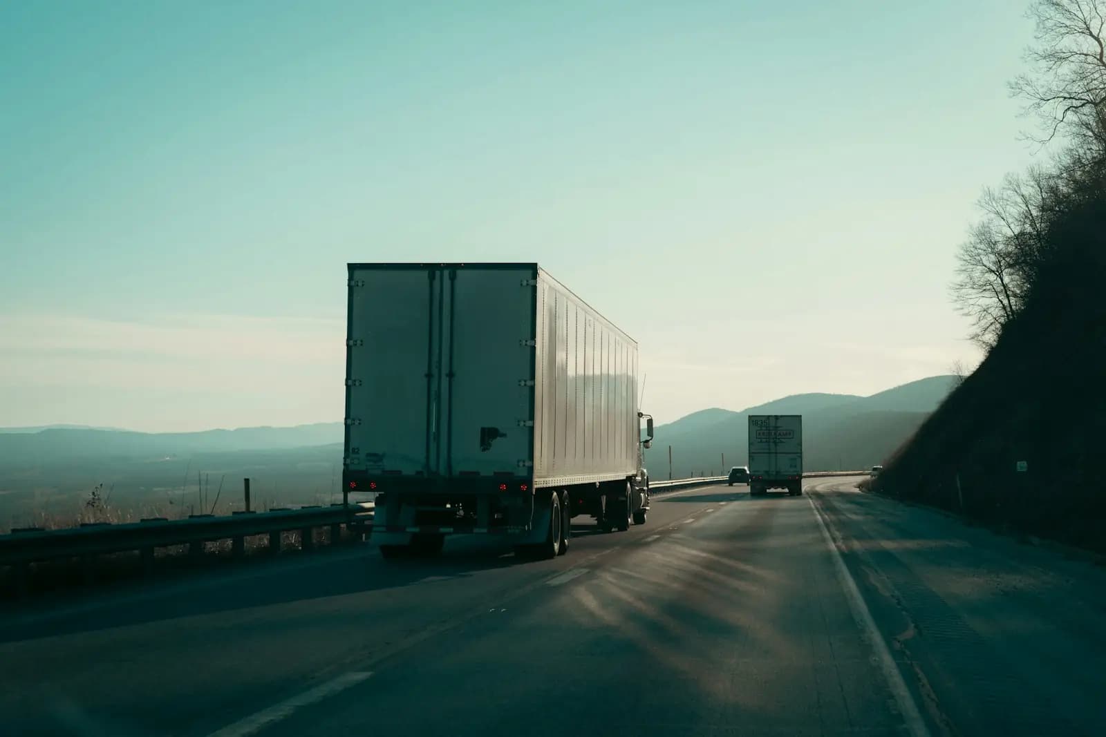 Two trucks on a highway