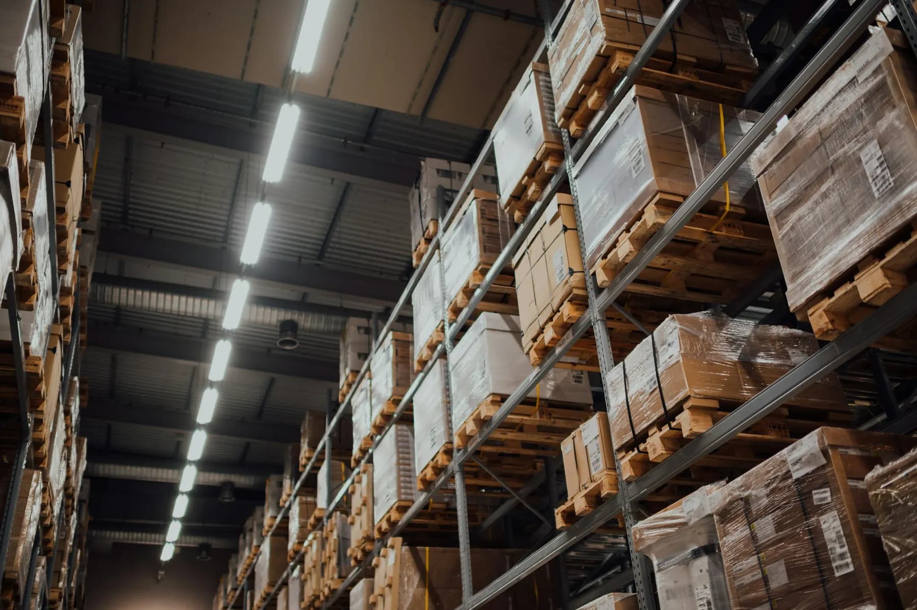 Tall racking with pallets and cardboard boxes
